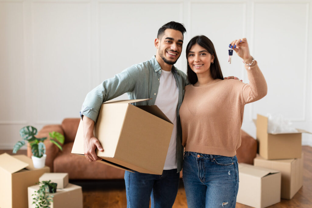 couple holding key